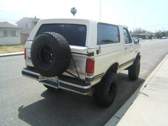 1988 Ford Bronco rear view with spare tire mounted on the tailgate