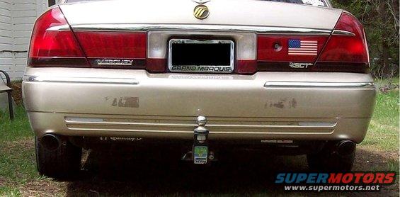 2000 Mercury Grand Marquis rear bumper, license plate frame reads GRAND MARQUIS, has an American flag sticker and 350T badging