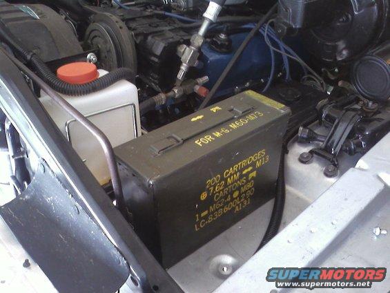 Engine bay with ammo can labeled '200 CARTRIDGES 7.62 MM'