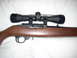 1992 Ford Bronco - A rifle with a scope is shown against a white background. The registry label is incorrect.