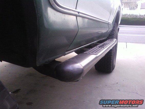side view of a vehicle's running board and exhaust pipe
