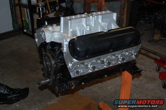 Engine on stand, silver intake manifold, black valve covers