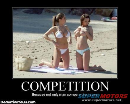 Two women in bikinis on a beach, one in white, the other in light blue bottoms