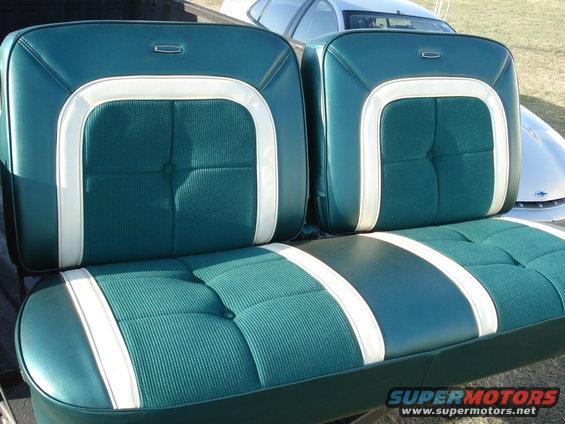 Green and white vinyl bench seat with textured fabric inserts