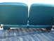 1979 Ford F-150 - The rear of two teal bench seats is visible, mounted above a truck bed.