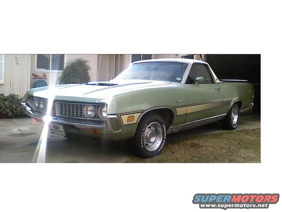 Green 1970 Ford Ranchero with a white roof and yellow stripe, parked in a driveway