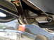 1996 Ford Bronco - Custom suspension components are visible, with a dark SUV in the background.
