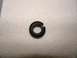 2003 Ford Crown Victoria - A single black rubber o-ring is shown against a textured white background.