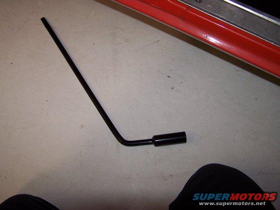 100_2573.jpg I welded a 3/4" deep socket onto the original tire iron to fit my new mags!