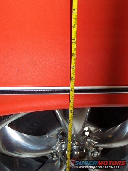 100_2563.jpg this is the rear fender height with the modified Ford rear coil springs installed; about 26.5" high; the car looks good, but the ride is not great since there is only about 1.5" of travel till the rearend hits the bumpstops.