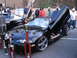 2001 Chevrolet Silverado 1500 - A modified black coupe with its doors open, surrounded by trophies at an outdoor event.