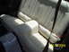1975 Ford Mustang II - Interior view of a car's rear bench seat, showing upholstery and seatbelts.