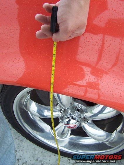 100_2552.jpg right hand front fender height, with 'lowered' coil springs installed {new big-block coils with 1.5 coils cut off} fender height is about 24". Looked great, but car rode poorly and dragged everywhere, so coils are getting replaced AGAIN!