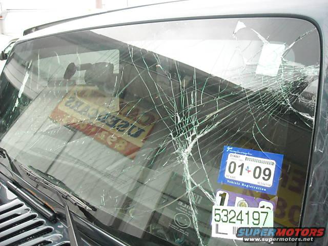 Windshield is shattered with a "01 09" sticker and another sticker with "5324197"