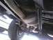 1978 Ford Bronco - This photo shows the undercarriage of a vehicle, including its exhaust and suspension components.