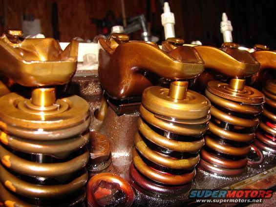 Engine valve springs and rocker arms with golden-brown finish