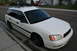 2001 Subaru Legacy - White 2001 Subaru Legacy wagon parked on a residential street with a roof rack installed.