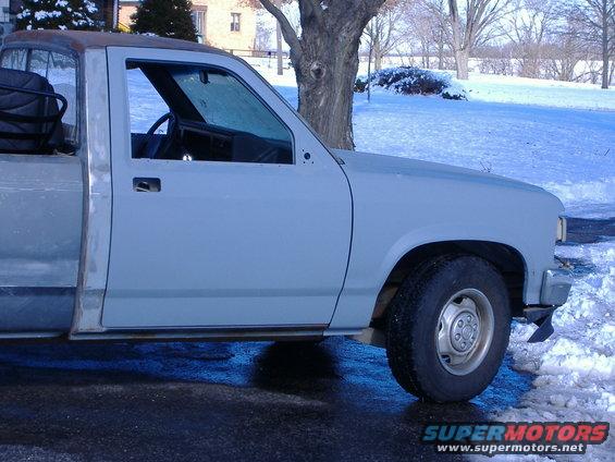 1992 Dodge Dakota truck cab and fender, primer gray, in snowy outdoor setting