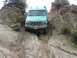 1996 Ford Bronco - This 1996 Ford Bronco navigates a challenging dirt trail, its off-road capabilities.
