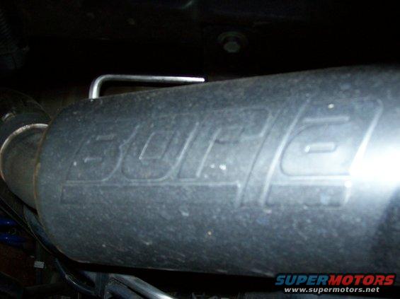Exhaust muffler with embossed 'BORLA' logo. Part of a vehicle's exhaust system