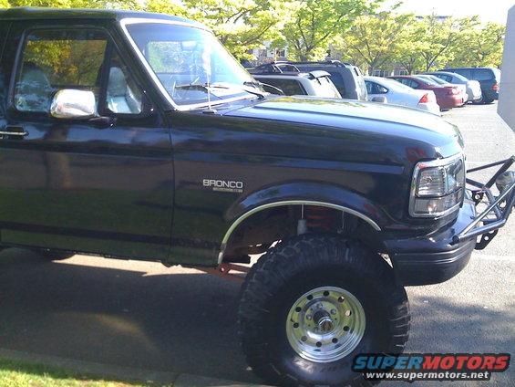 Black 1992 Ford Bronco with custom front bumper and lifted suspension