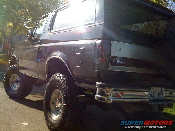 Lifted 1992 Ford Bronco rear view, showing off its big tires and chrome bumper