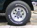 1990 Ford Bronco - Close-up of a vehicle's wheel and tire, showing BFGoodrich All-Terrain T/A branding.