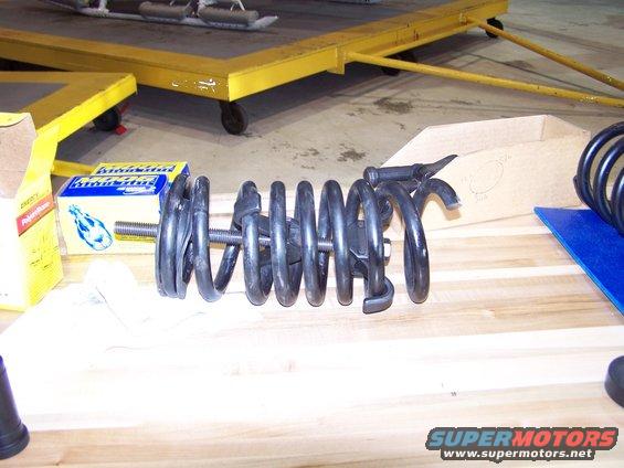 100_2636.jpg spring compressor tool being used to install new front coil springs; this is a lot of work and DANGEROUS!