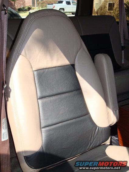 Upholstery by Junior's Upholstery in Conroe, TX.

It is vinyl, but feels and looks just like leather.