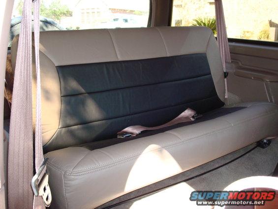 Upholstery by Junior's Upholstery in Conroe, TX.

It is vinyl, but feels and looks just like leather.