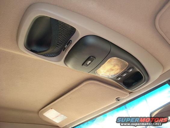 Overhead console with map lights and storage compartment in a vehicle interior