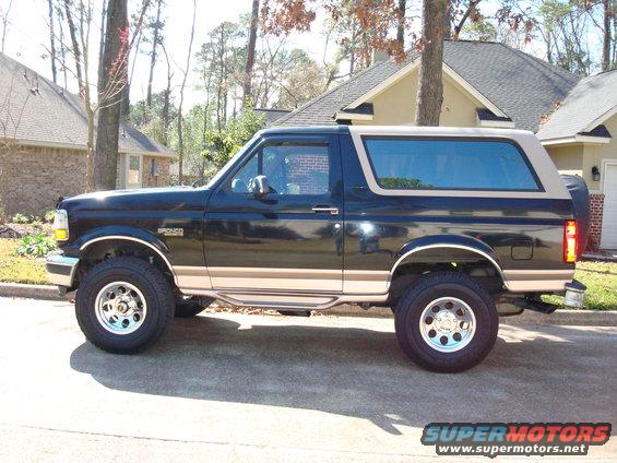 1996 Ford Bronco parked on street, side view