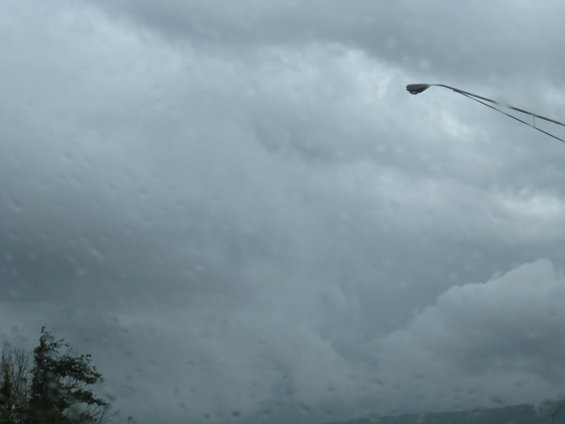 Stormy sky with a street lamp on the right