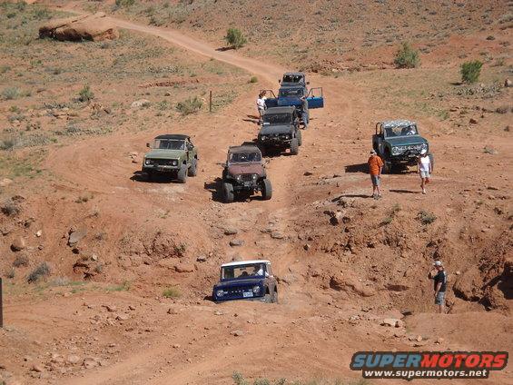 1986 Ford Bronco II and other SUVs on a desert trail