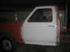 1983 Ford F-250 - This 1983 Ford F-250 is undergoing body work, with primer and paint visible on different panels.