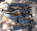 1992 Ford Explorer - Several used front suspension parts are displayed on a wooden board, showing signs of wear and rust.