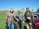 1986 Ford Bronco - Three men in camouflage gear stand outdoors holding paintball guns.