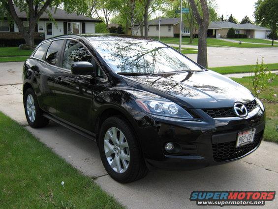 Black 2007 Mazda CX-7 parked on a driveway, front 3/4 view