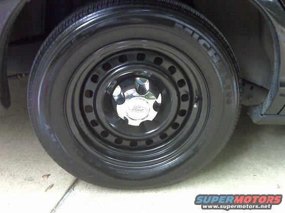 Black steel wheel with Ford logo center cap and Michelin tire