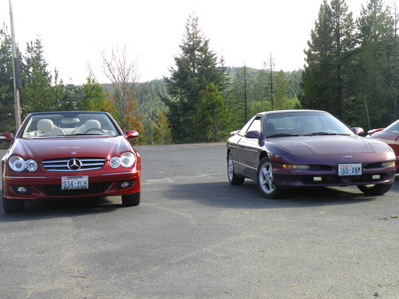 Purple Ford Probe with a license plate reading 165-XNM parked on asphalt