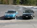 1989 Nissan 300ZX - Two coupes, a blue Ford Probe and a black Mazda 626, are parked next to each other on a paved surface with trees in the background.