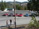 1989 Nissan 300ZX - A group of sports cars, including a 1989 Nissan 300ZX, gathered in a scenic mountain parking lot.