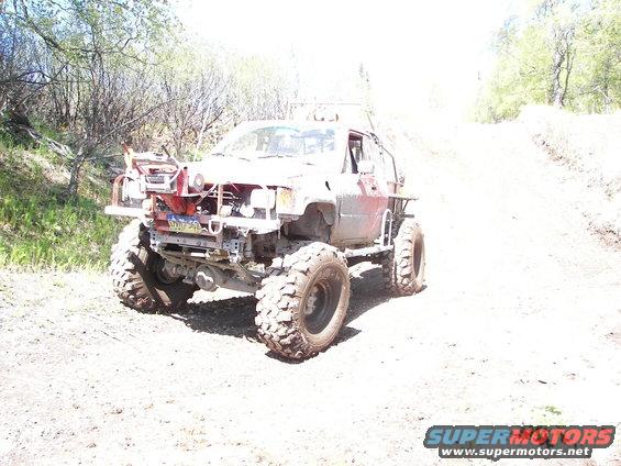 Modified off-road truck with large tires and custom bumper