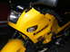 2002 Kawasaki Ninja - A yellow Kawasaki motorcycle is shown from the front, with 'Ninja' visible on the fairing.