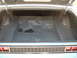 1971 Ford Torino - The trunk of a car is shown with its liner and spare tire tools. The rear bumper and taillights are visible.