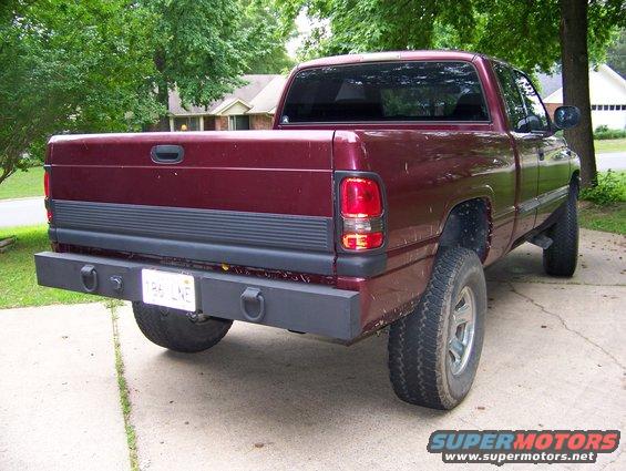 Maroon 2001 Dodge 1500 pickup truck, rear view with aftermarket bumper