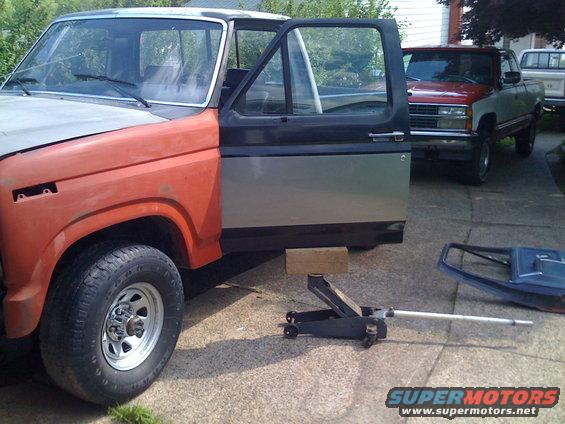 Using a floor jack to install a door by yourself