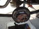 1971 Ford Torino - Rear drum brake assembly removed for service, with old brake fluid collected in a pan.