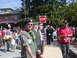 2004 Ford Mustang - Outdoor gathering with individuals in military uniforms and civilian attire.