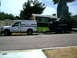 2000 Ford F-250 - White 1997 Ford F-250 with camper shell tows trailer carrying a black Bronco.